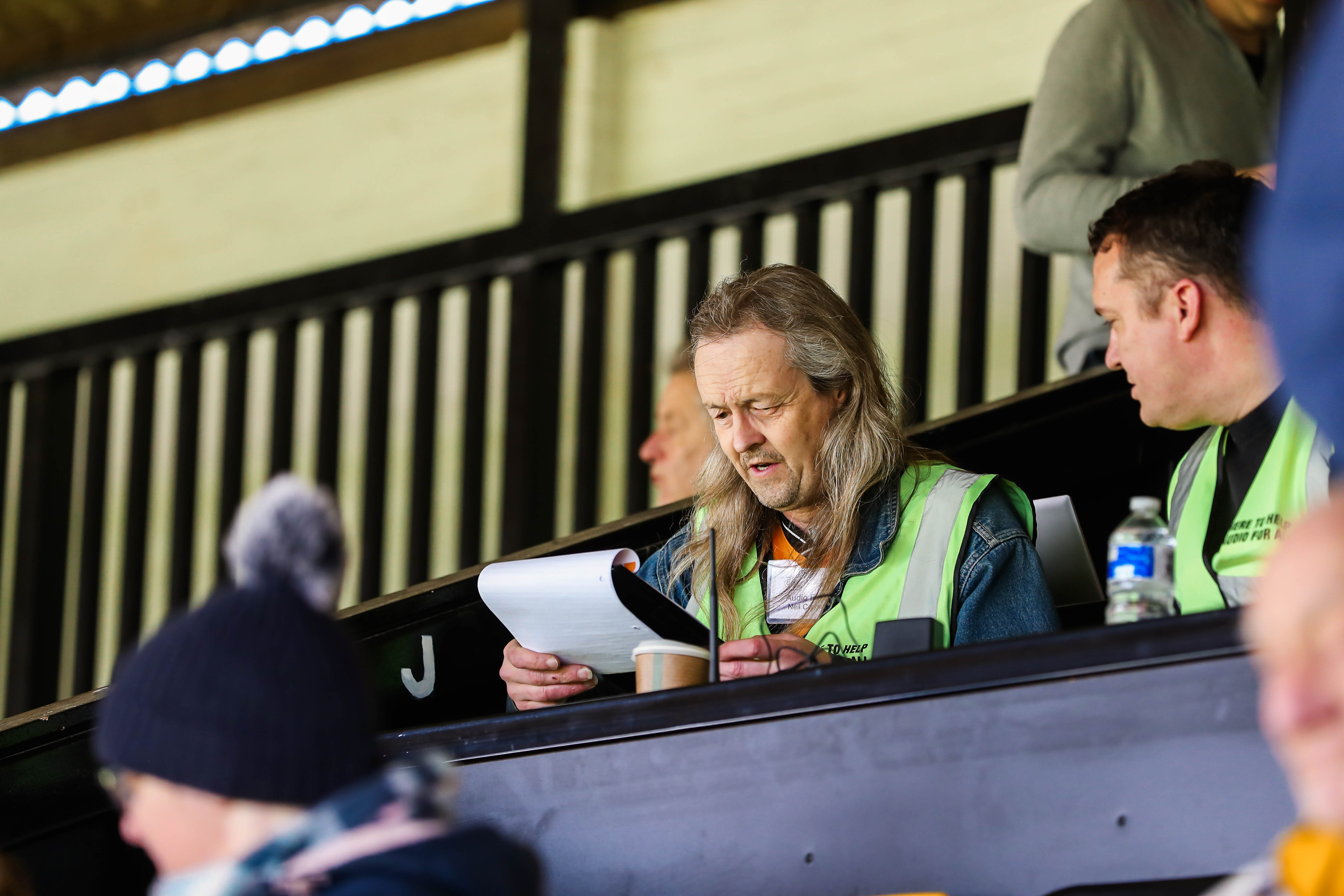 The Club's Audio for All Commentator reads up on his notes