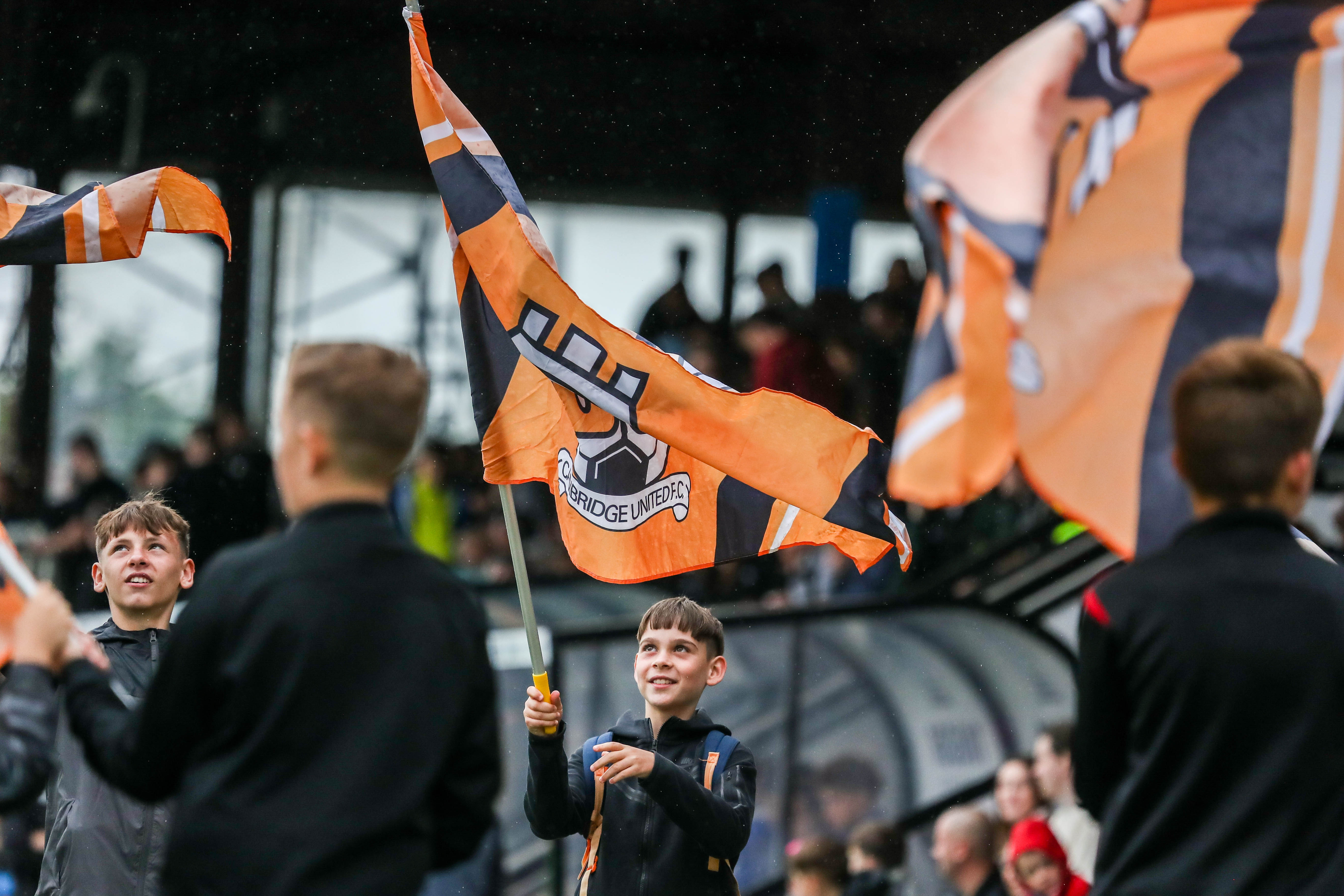 A young fan waves his flag ahead of kick-off