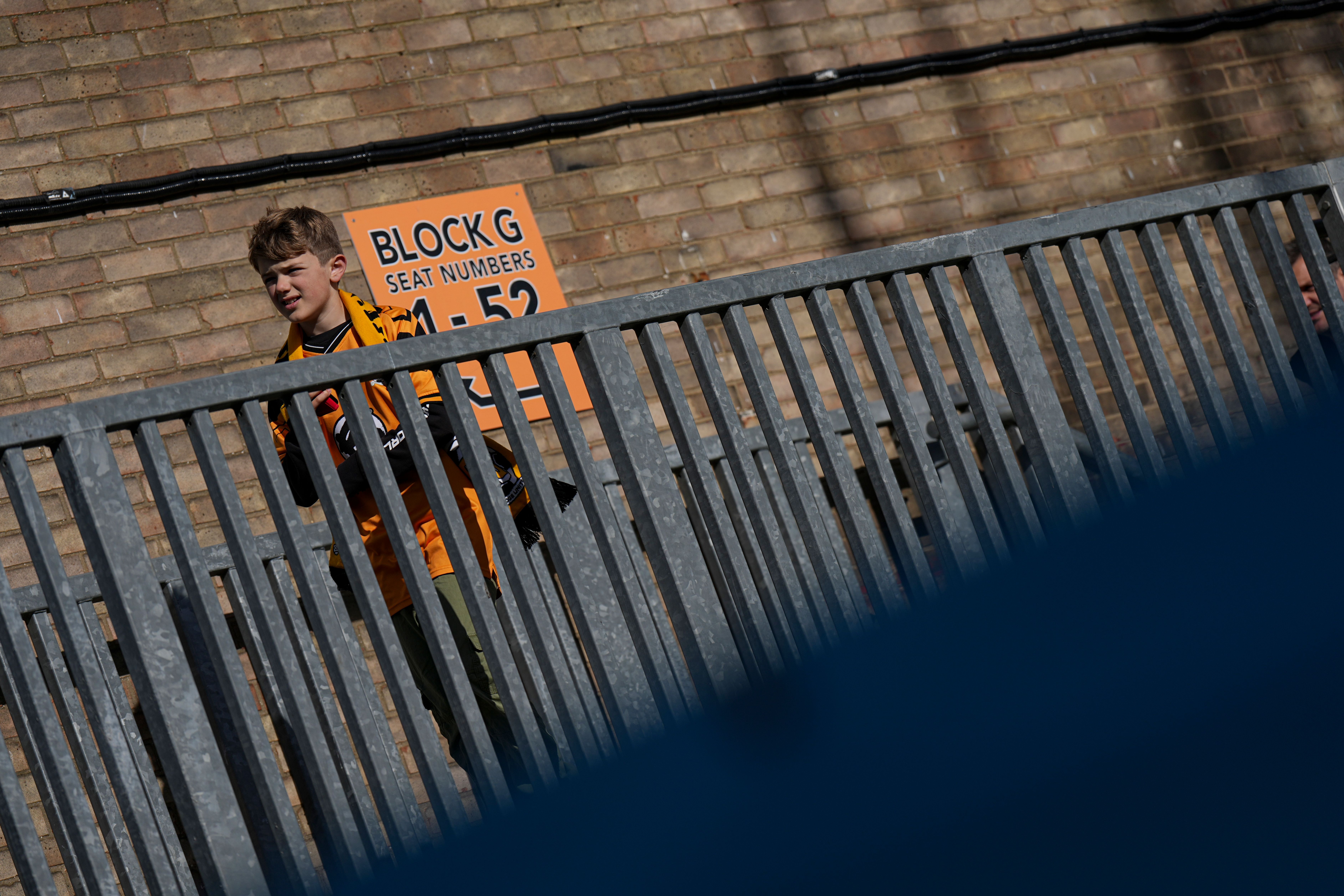 A young supporter makes his way inside the Cledara Abbey Stadium