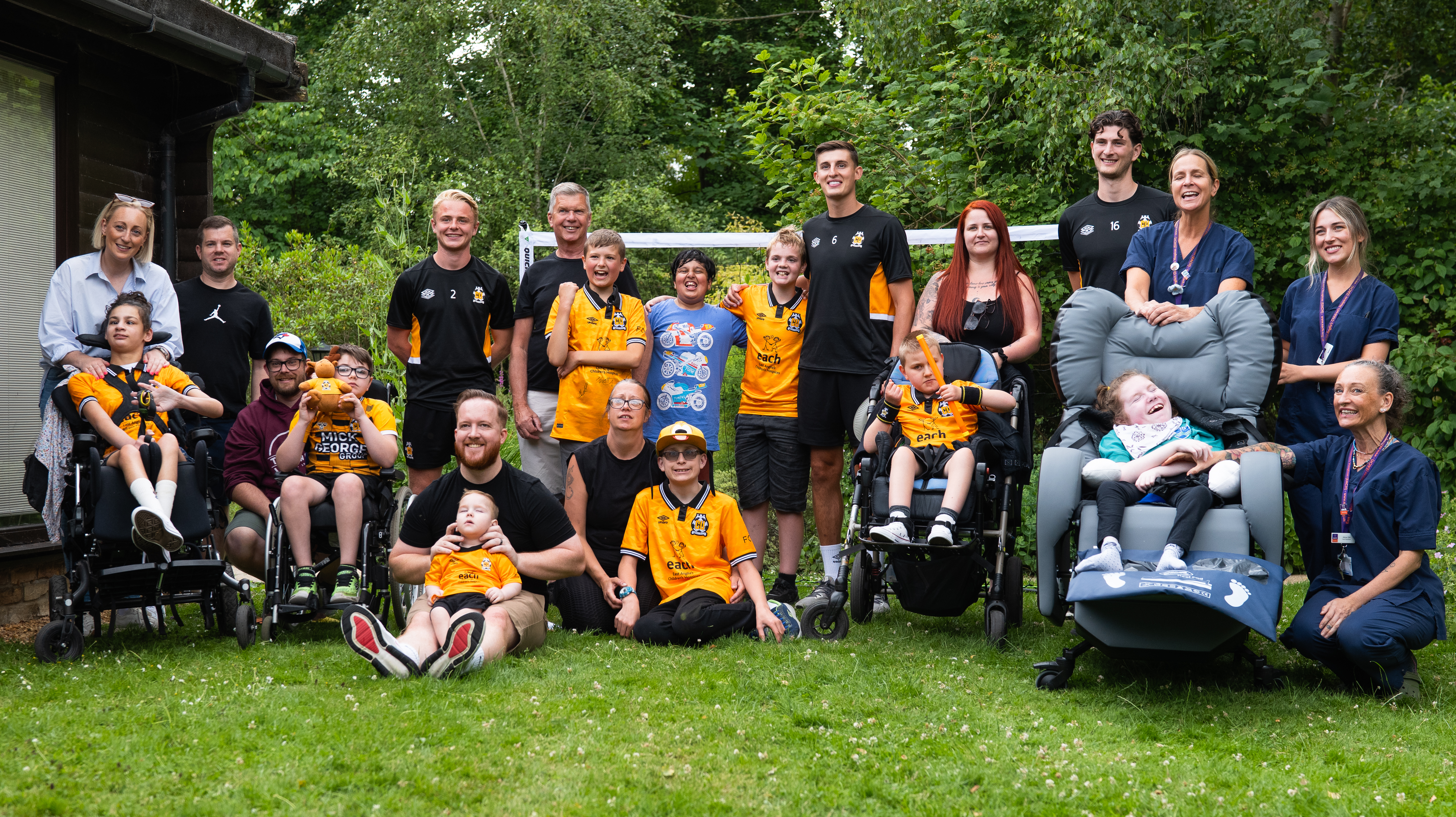 Cambridge United players with staff and families at EACH in Milton