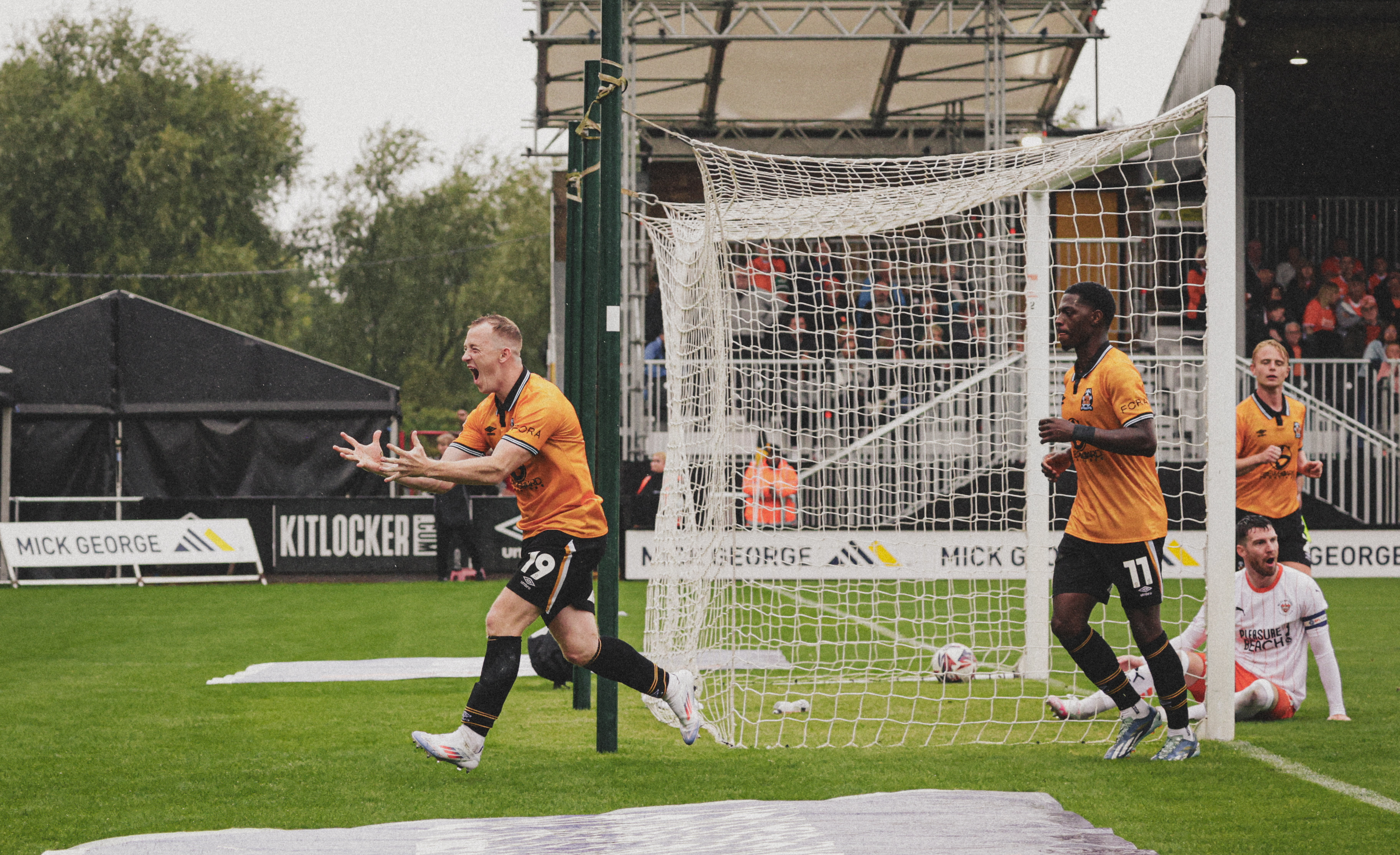 Shayne Lavery celebrates in-front of the Blackpool fans