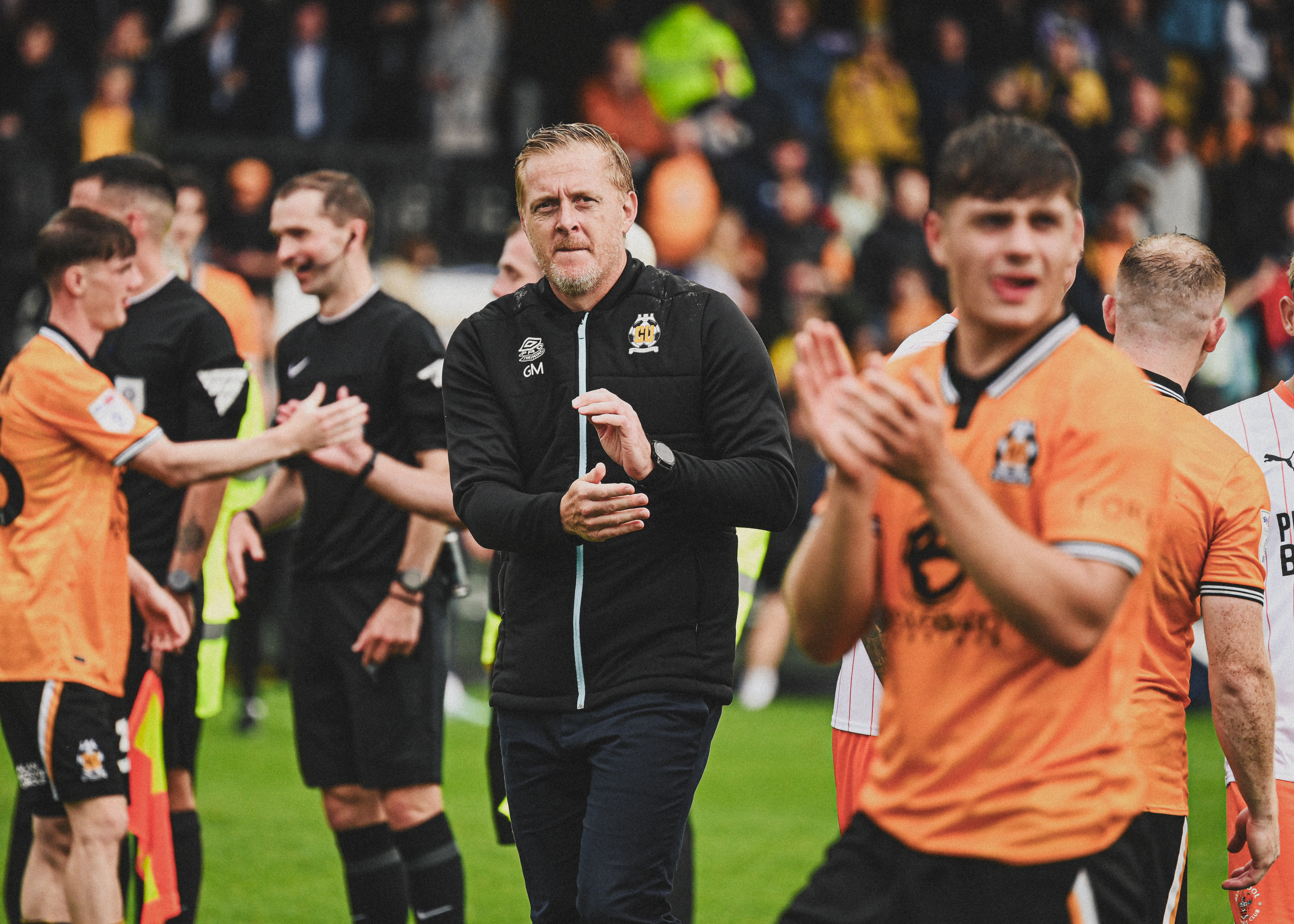 Garry Monk applauds the supporters