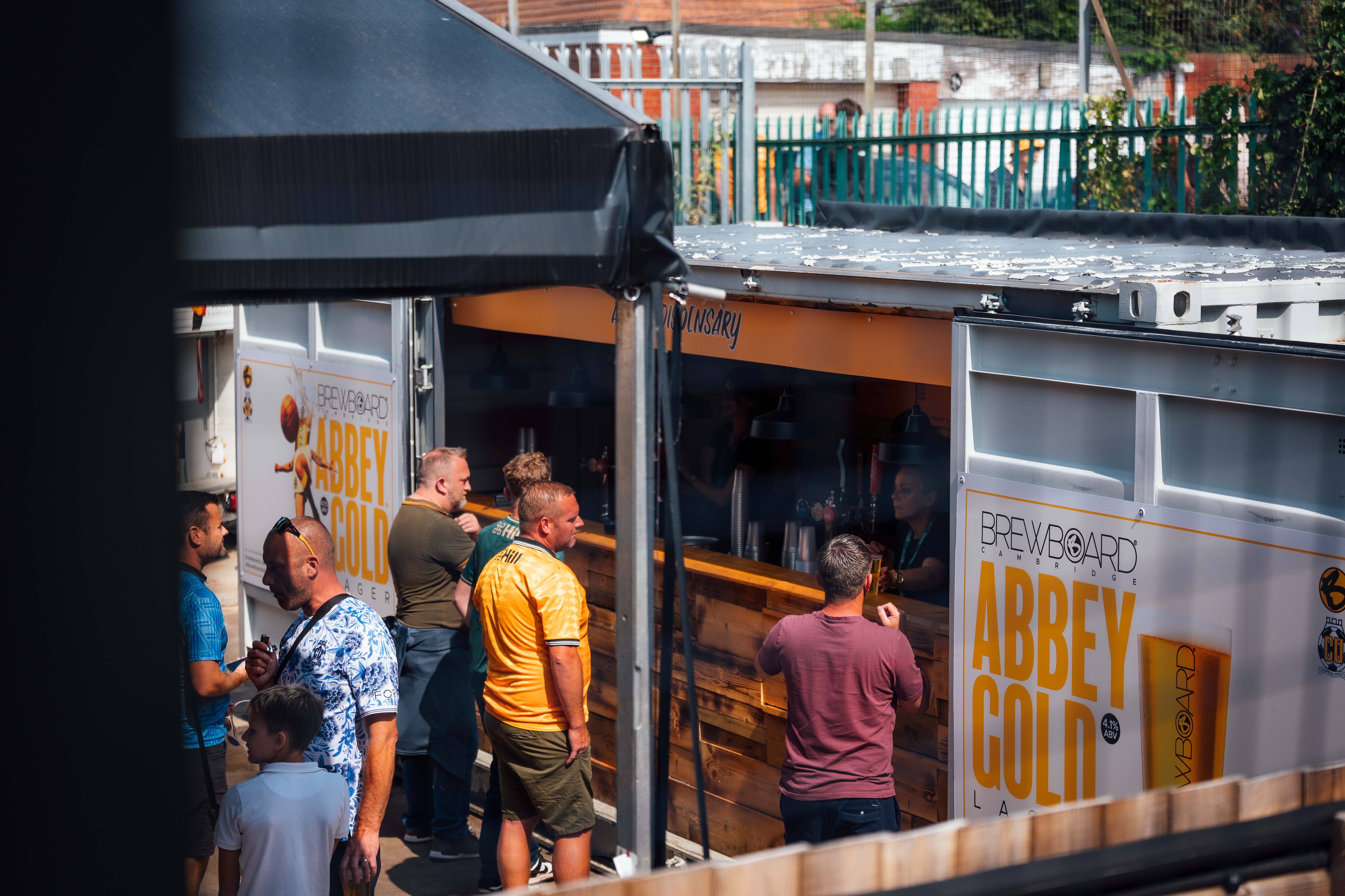 Fans buying a drink at the Cledara Abbey Stadium