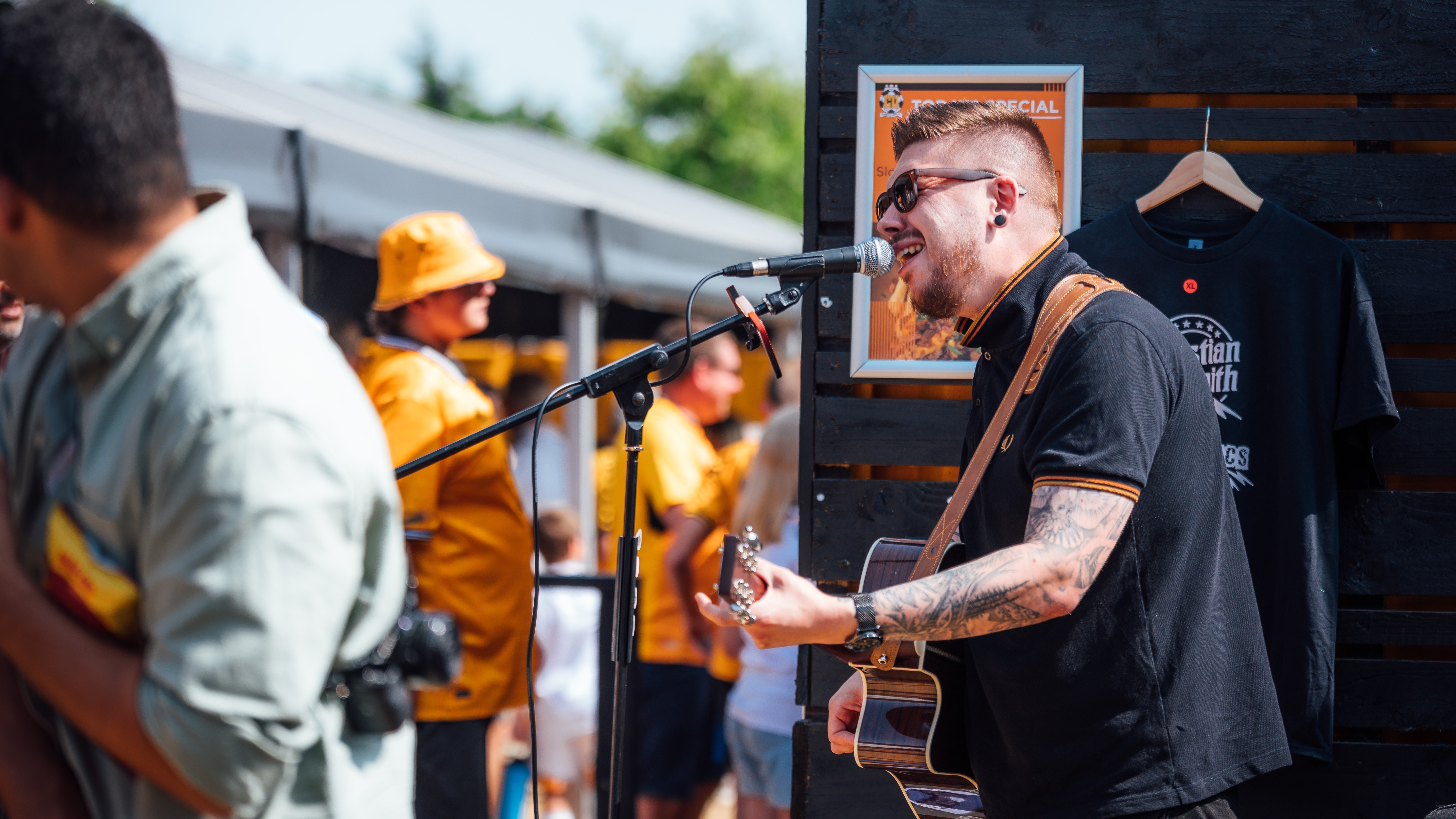 Musician Christian Smith performing in the Main Stand Fan Zone