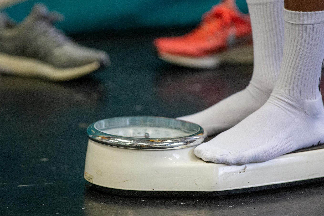 A close up of a player being weighed