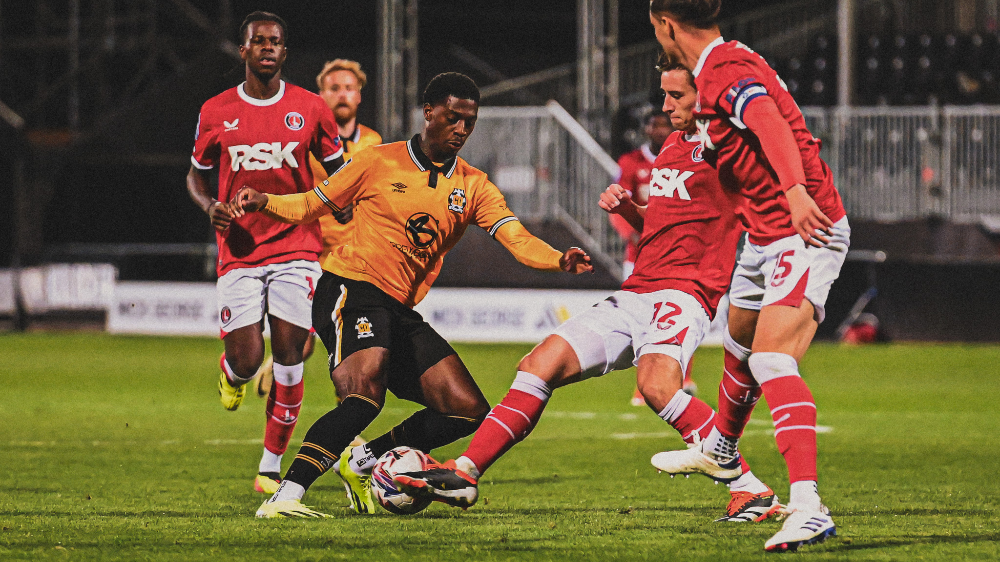 Kaikai being tackled by a Charlton Defender