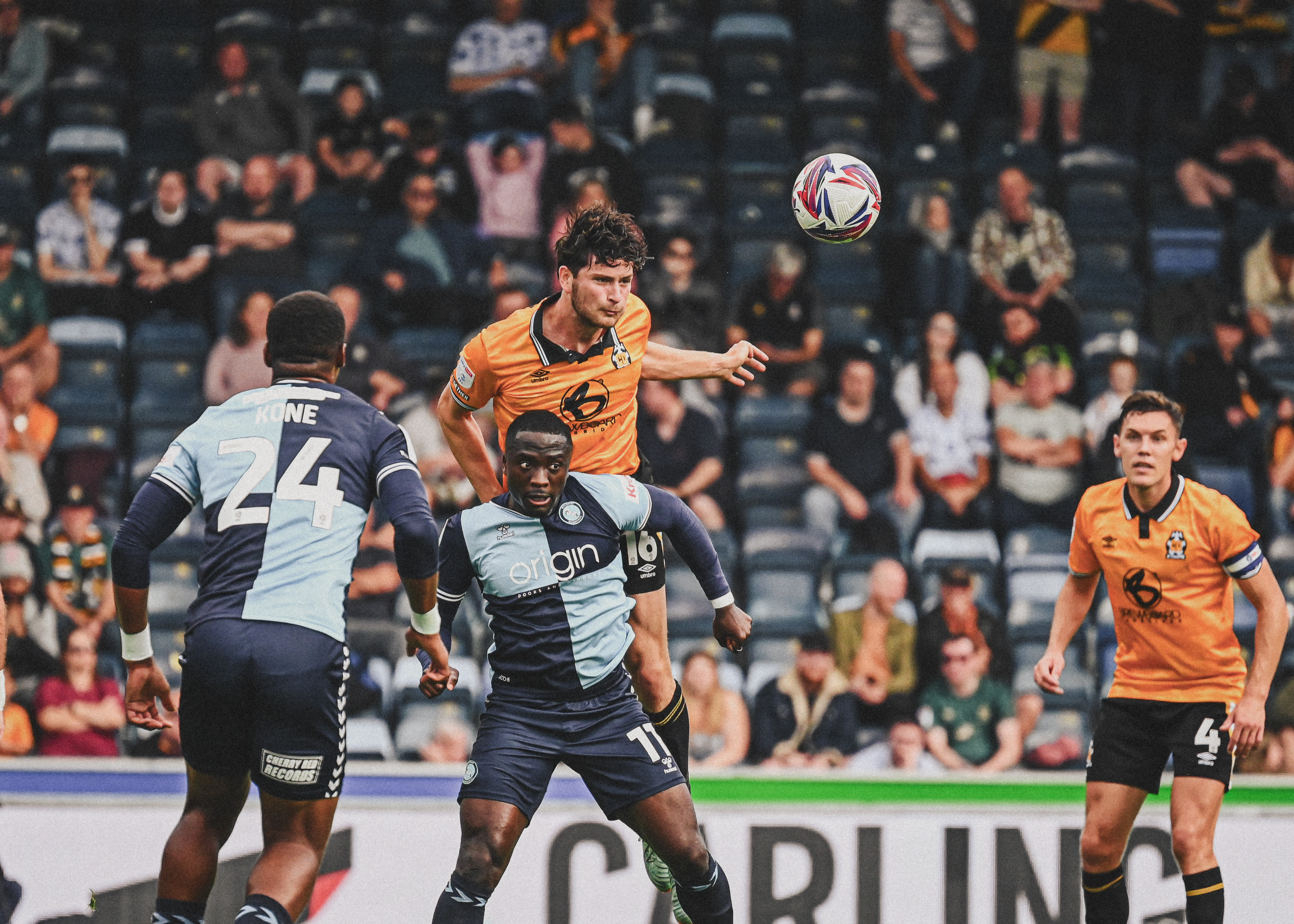 Zeno Ibsen Rossi heading the ball against Wycombe