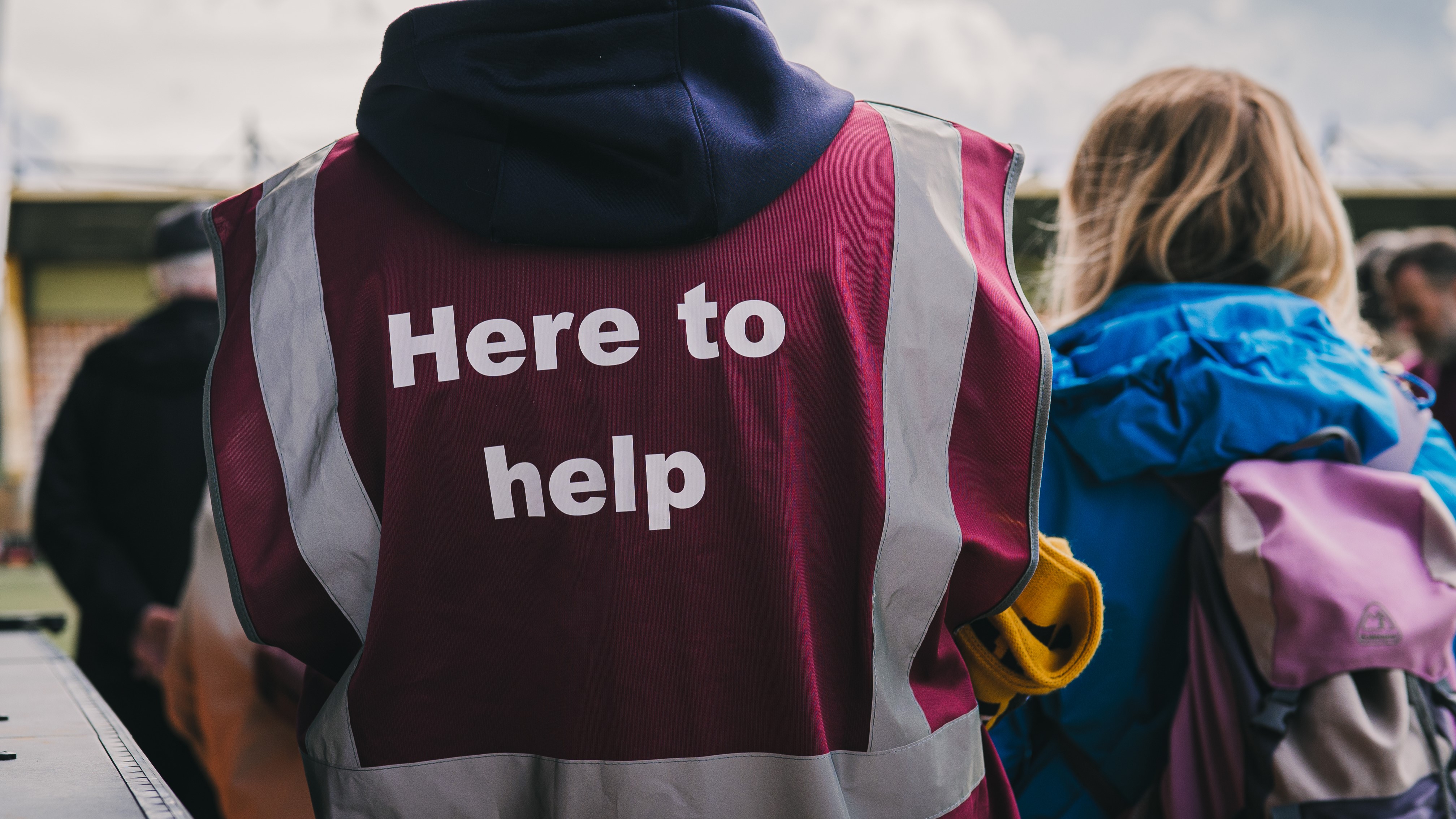 A close up an Abbey Helper's hi-viz jacket