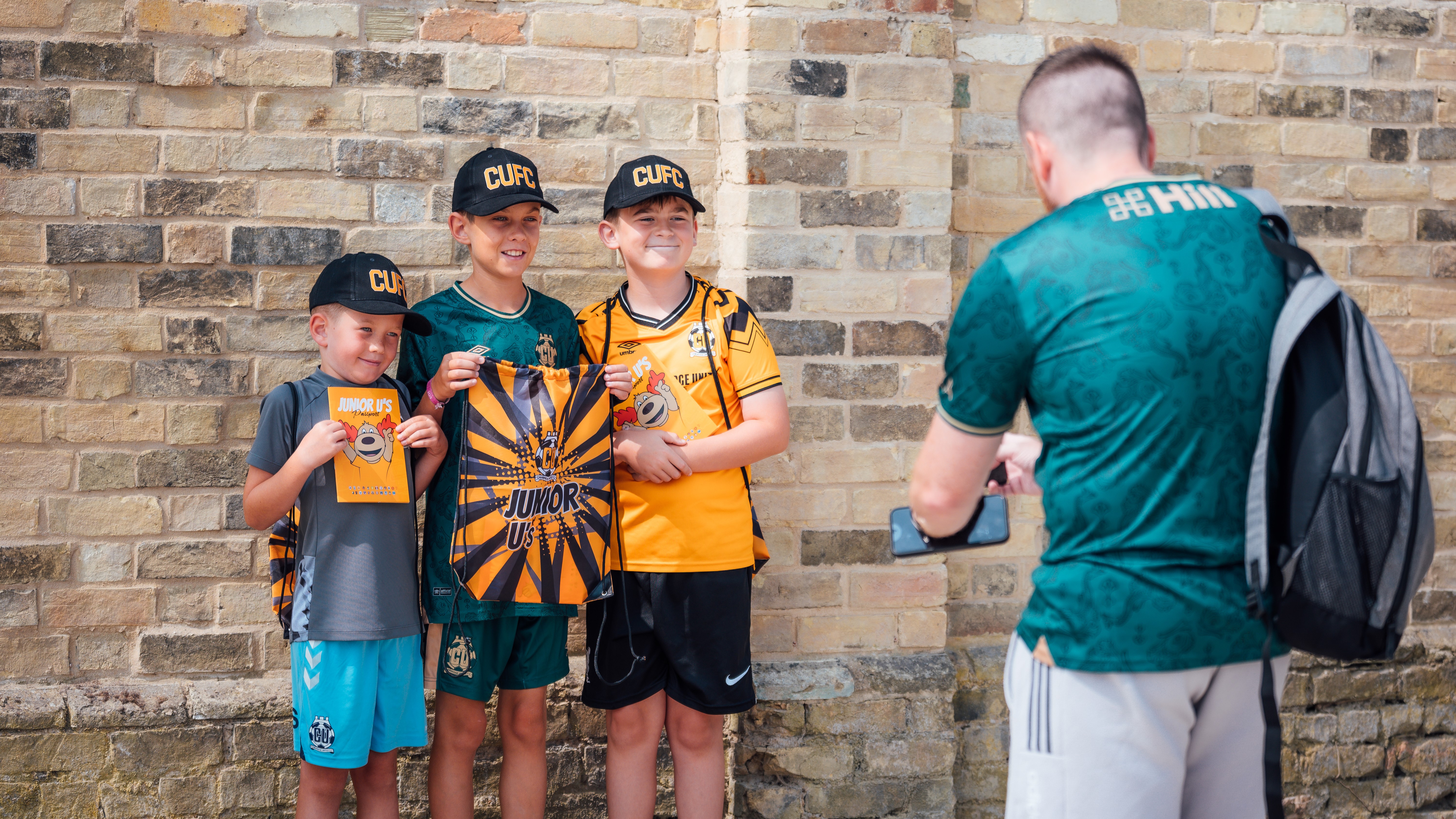 Young fans show off their Junior U's gear