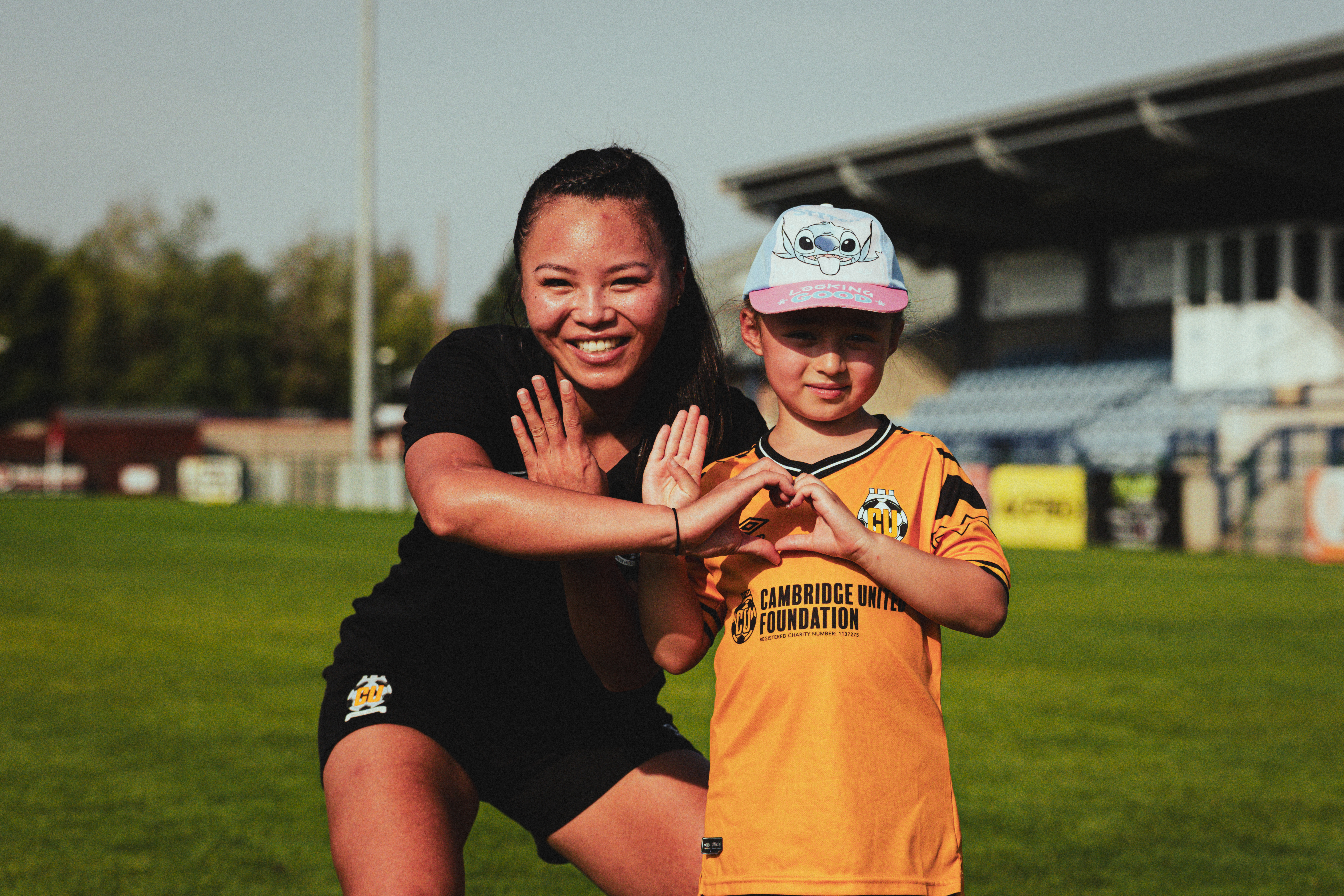 Bella Simmons with a young fan