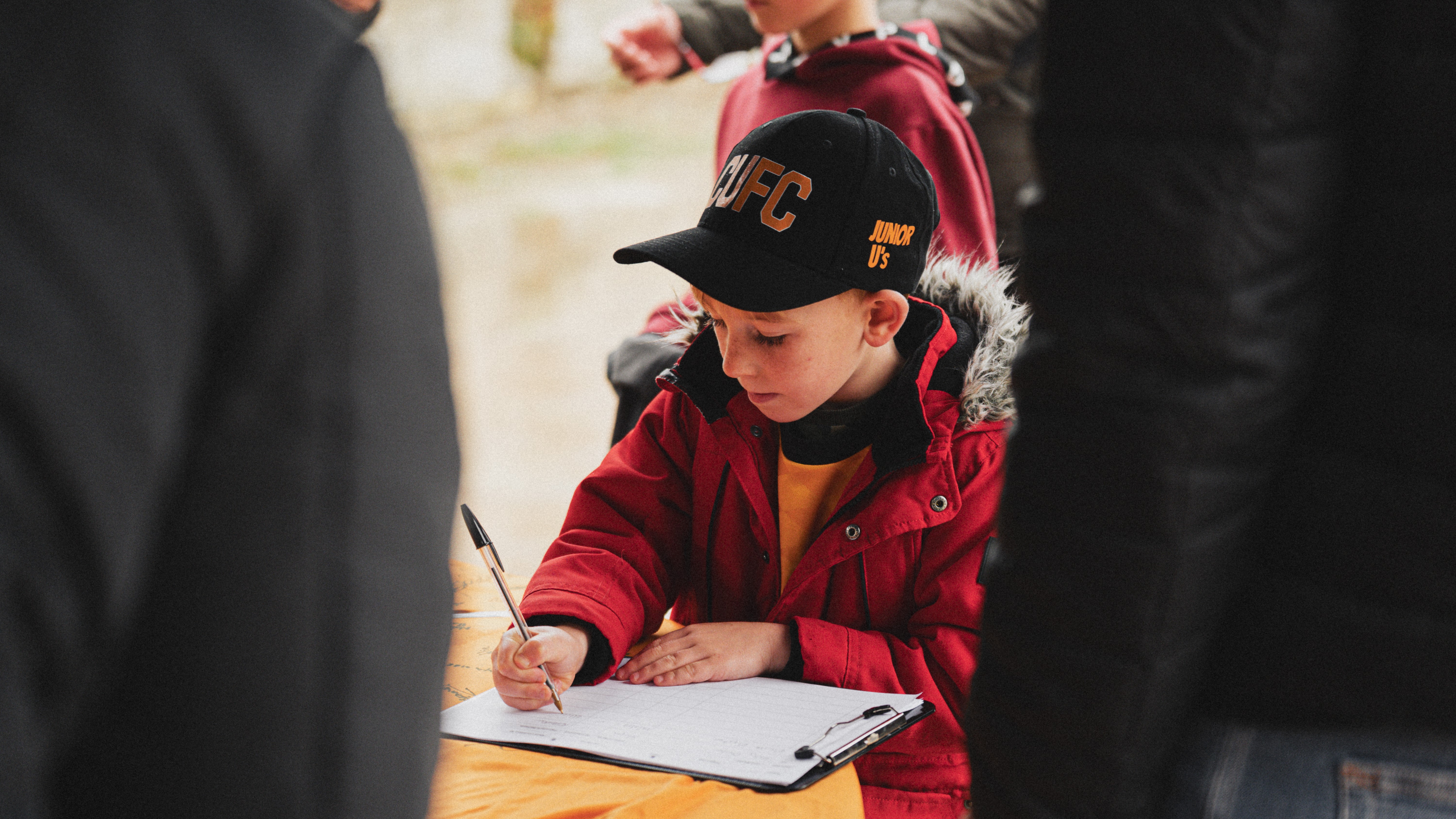 A fan signs the Cambridge United giant shirt