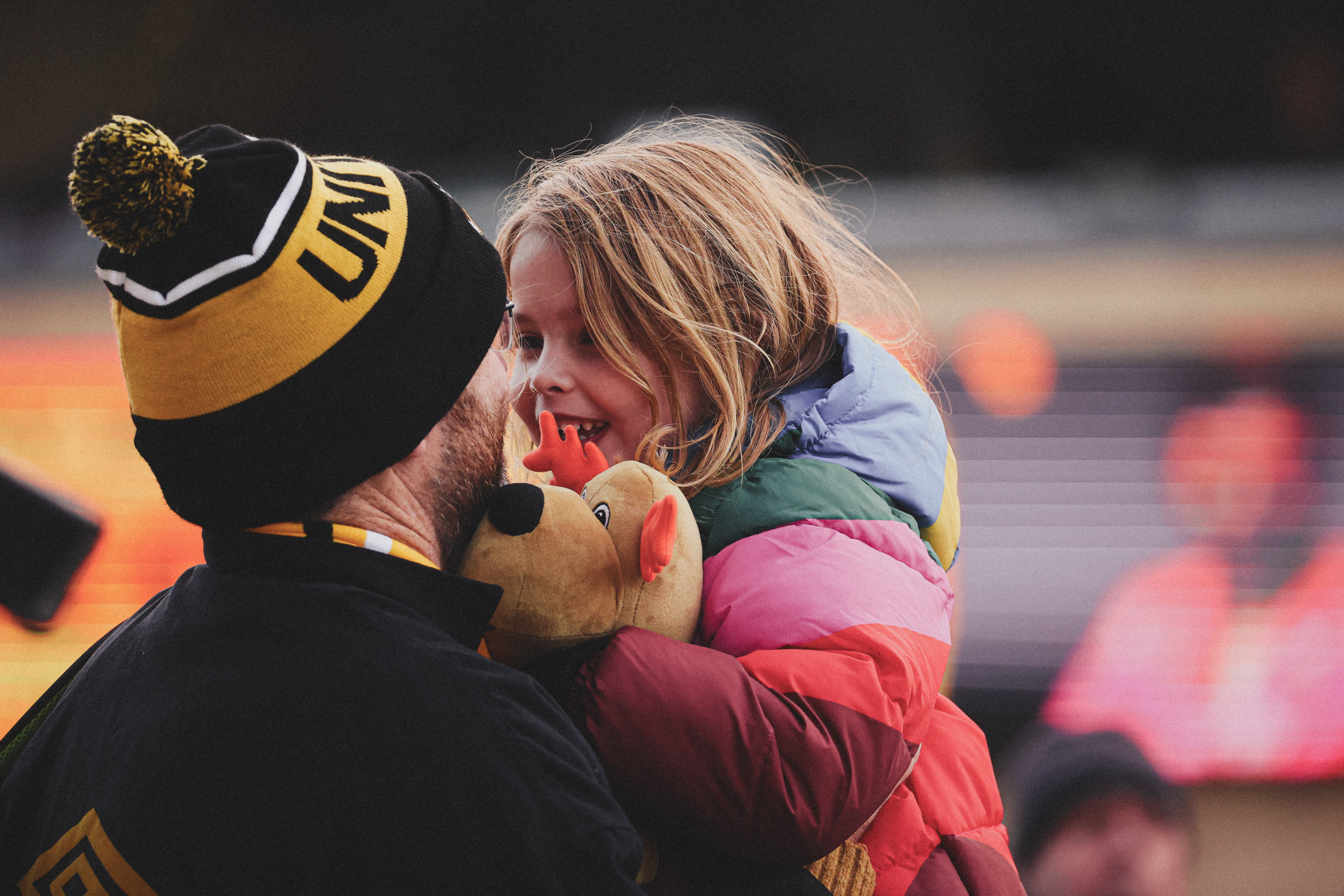 A father and daughter at the game