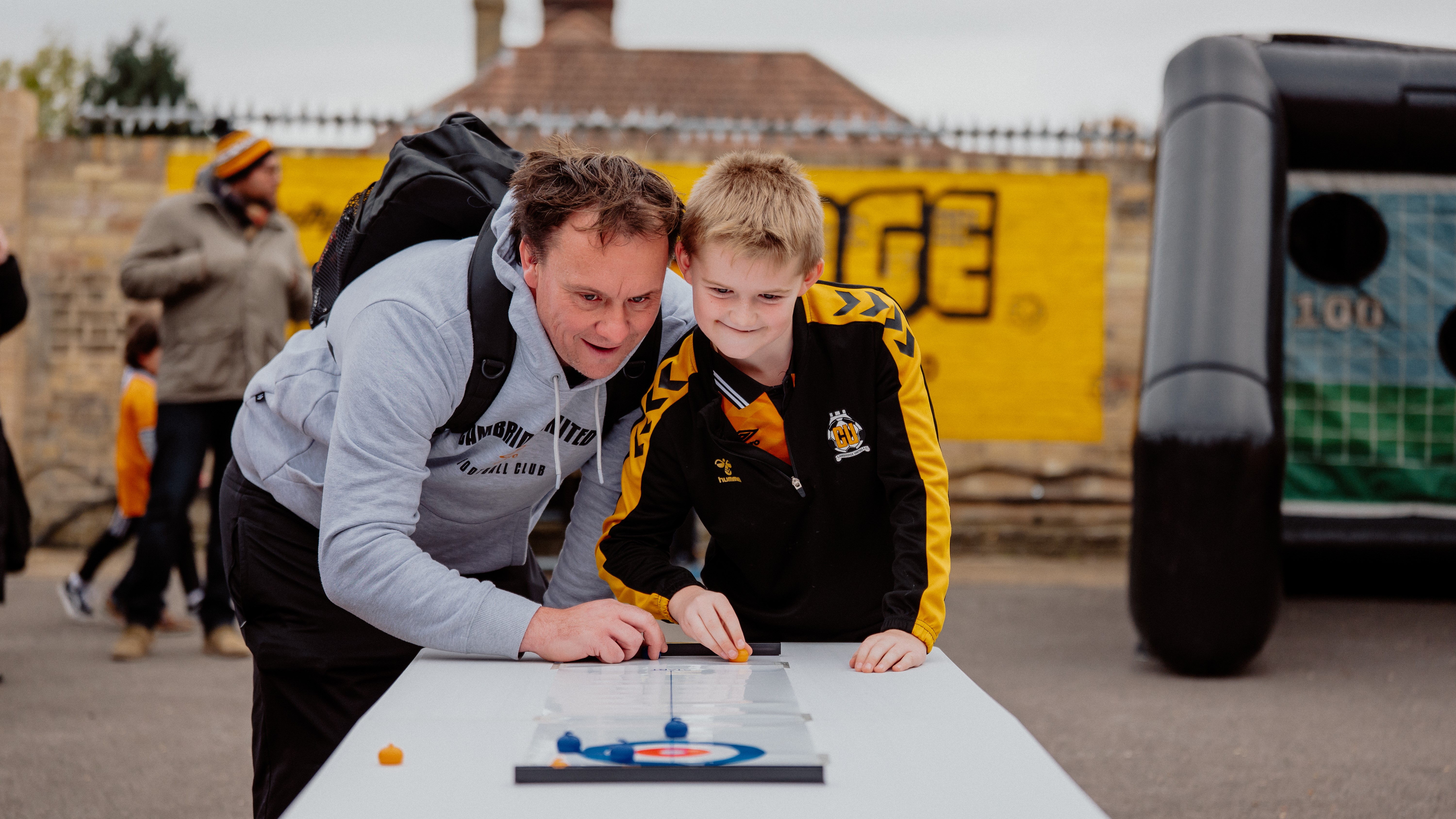 A father and son in the Junior U's Kids' Zone