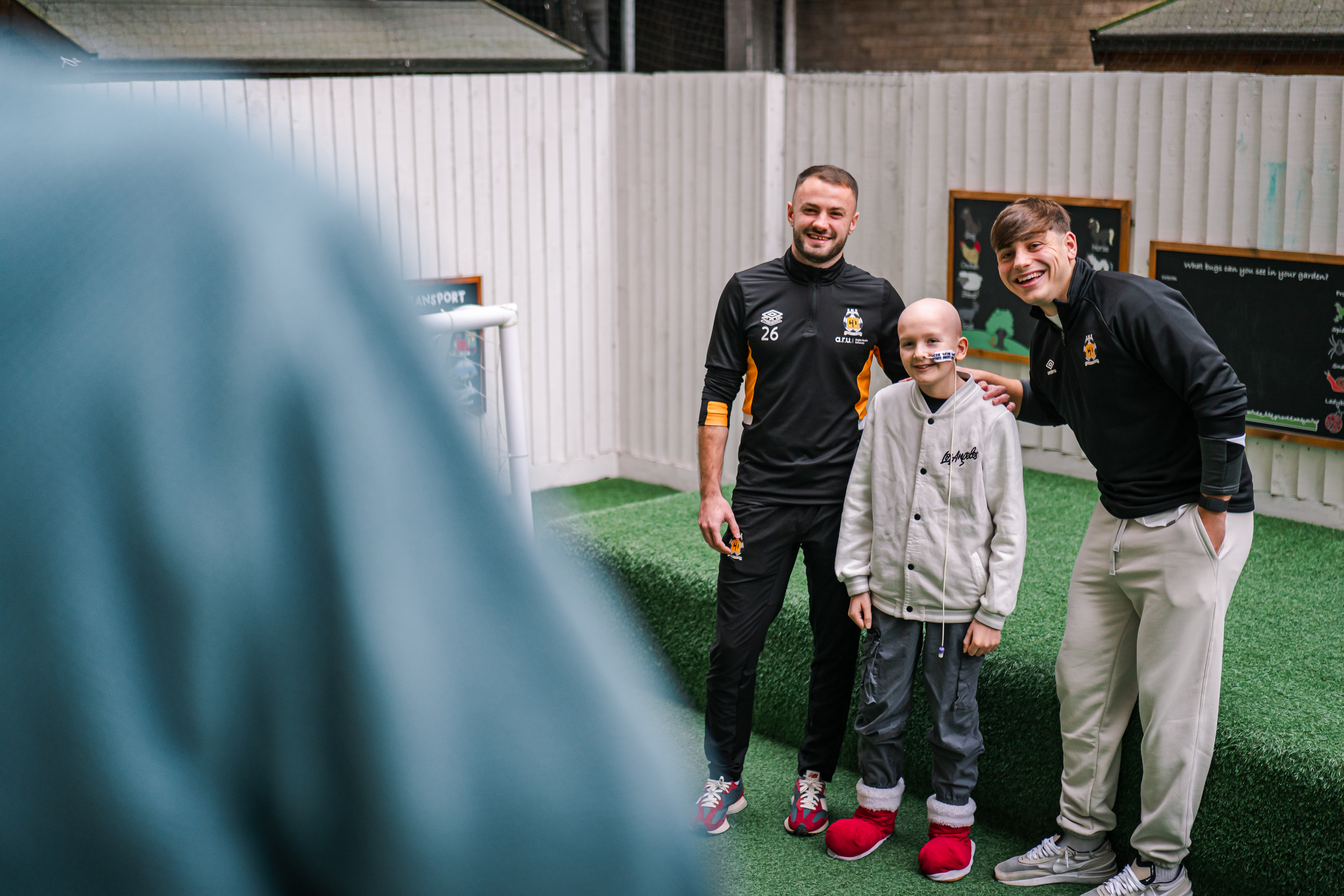 James Gibbons and Josh Stokes with a pupil from Pilgrims Pathway School