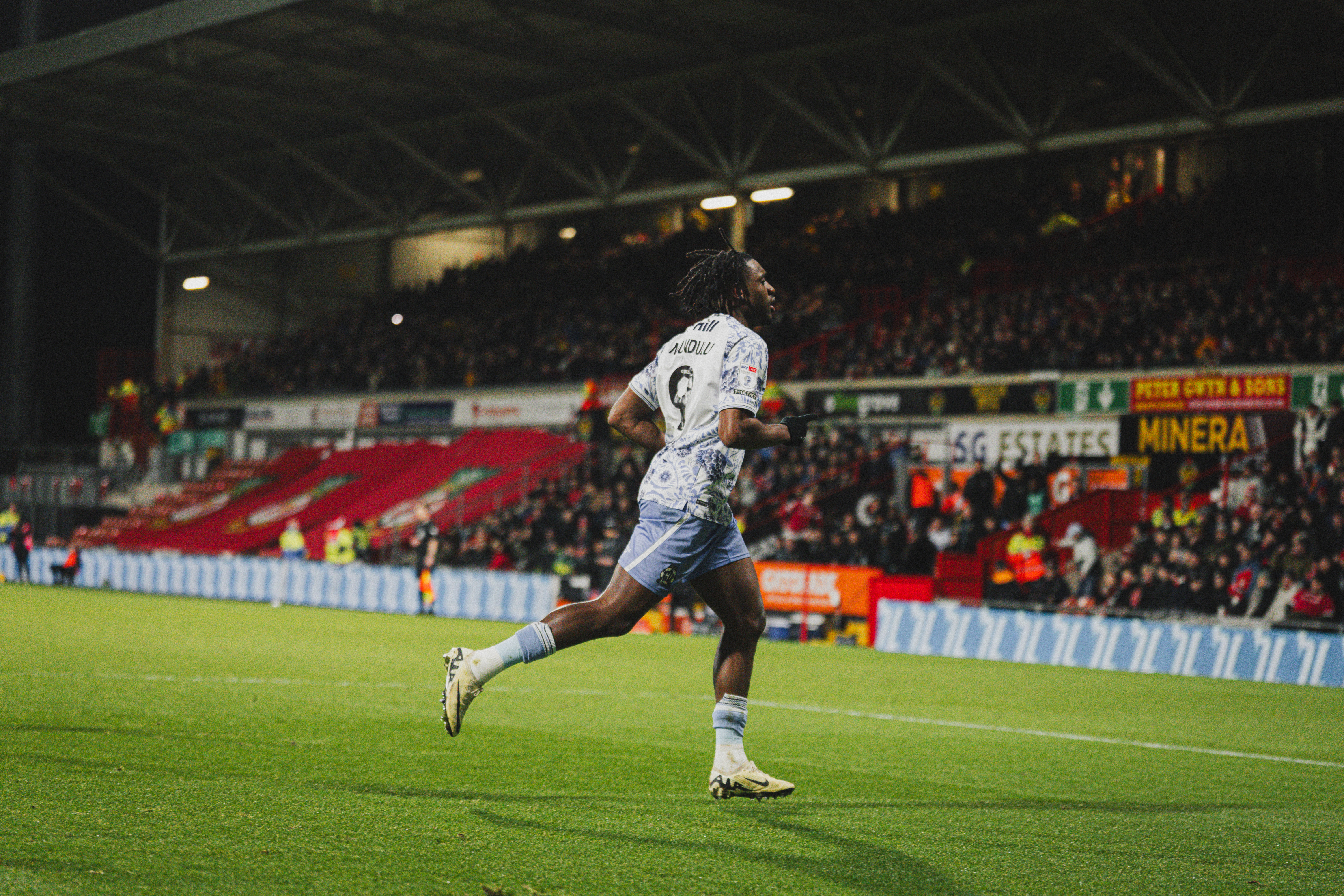 Dan Nlundulu celebrates scoring against Wrexham