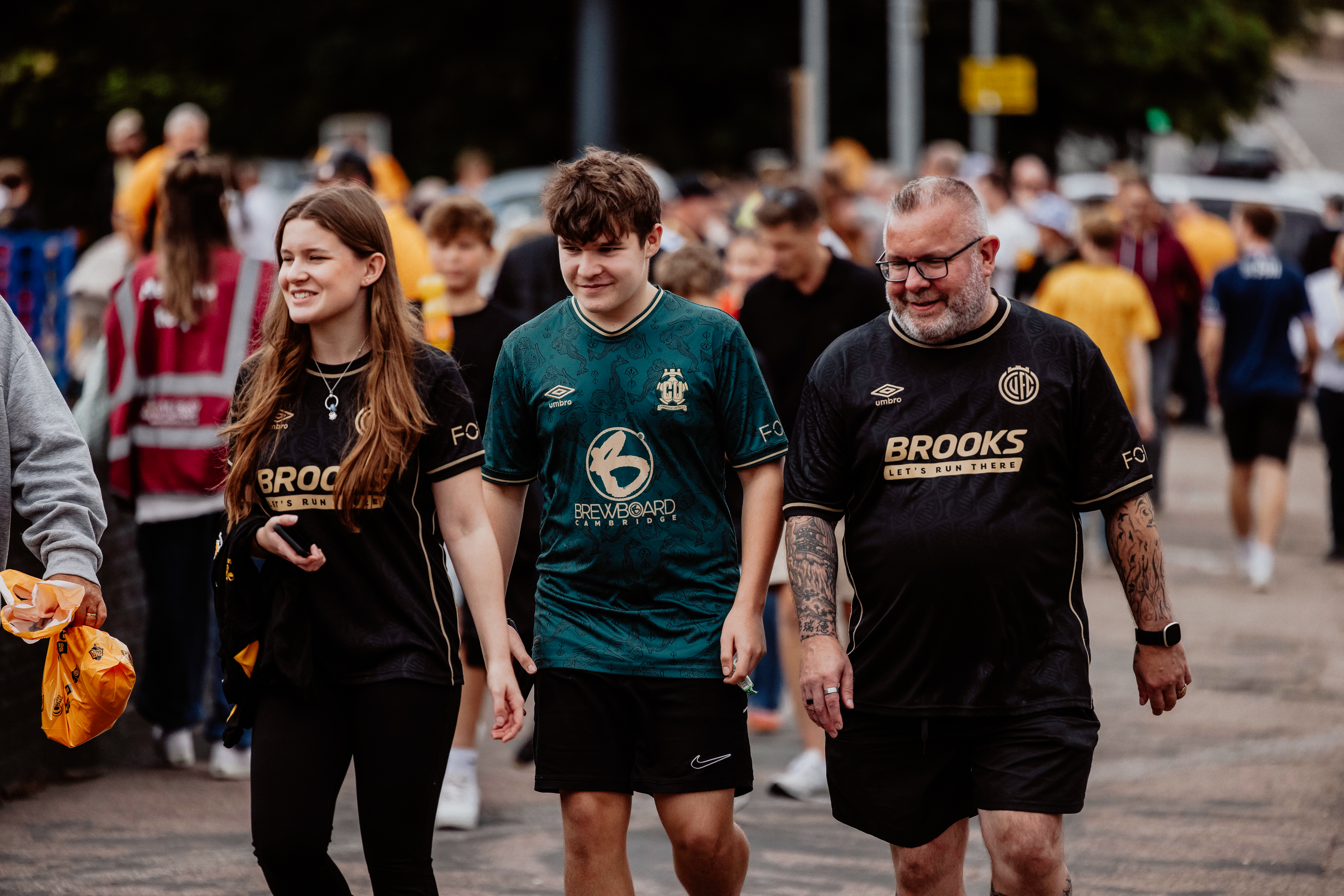 Fans walking to the Cledara Abbey Stadium