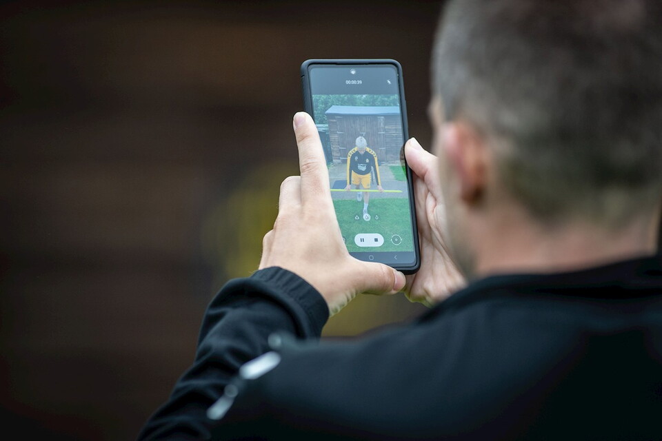 A member of staff records a player during pre-season testing