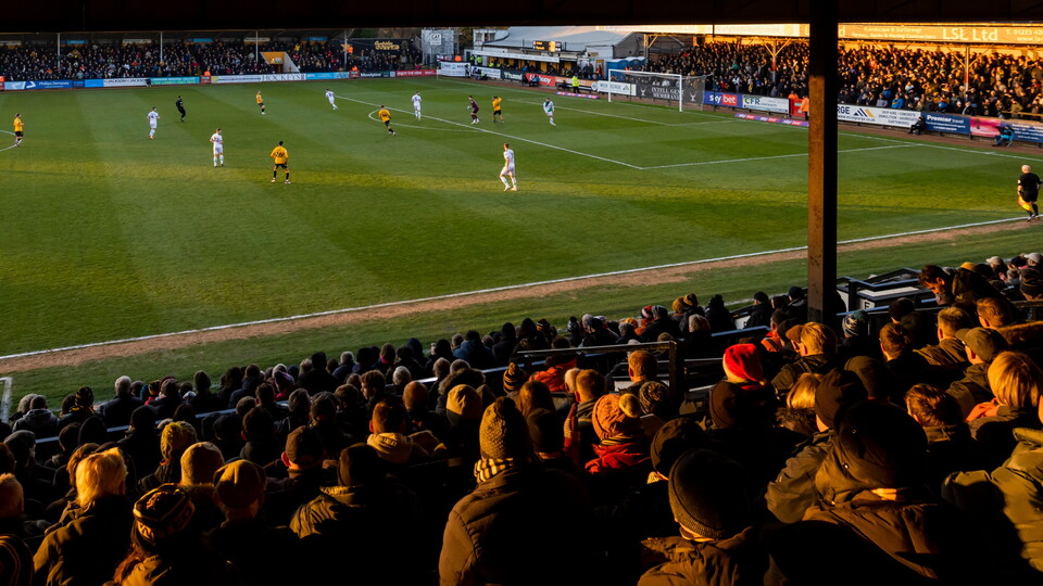 Supporters watch the game from the Main Stand
