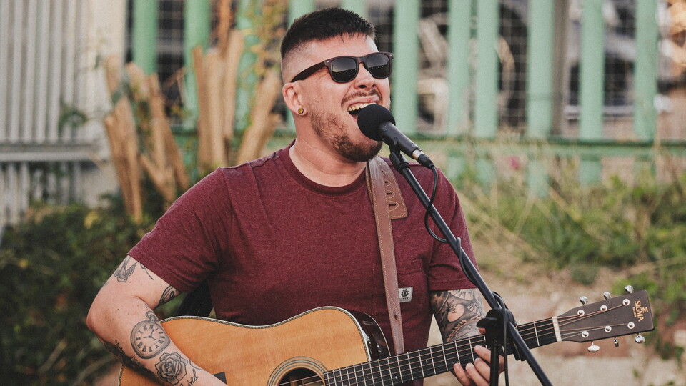 Christian Smith performs in a Fan Zone