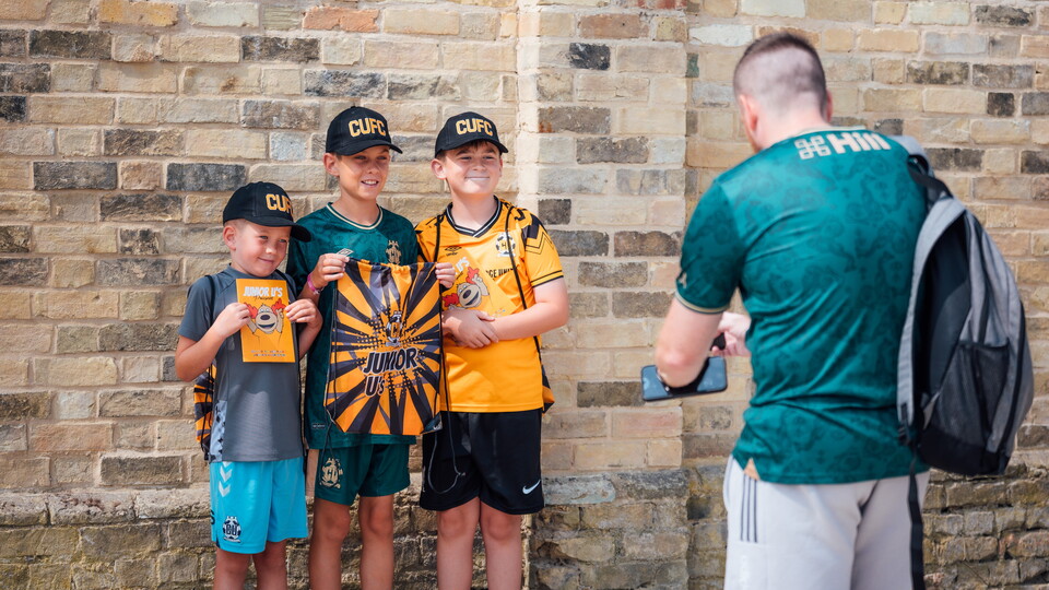 Young fans show off their Junior U's gear