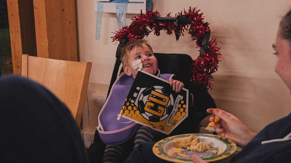 Cambridge United players and staff visit EACH
