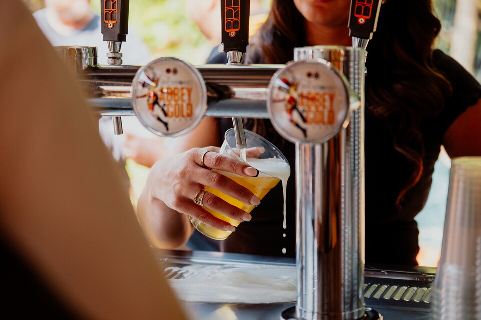 A close up a pint of BrewBoard being poured
