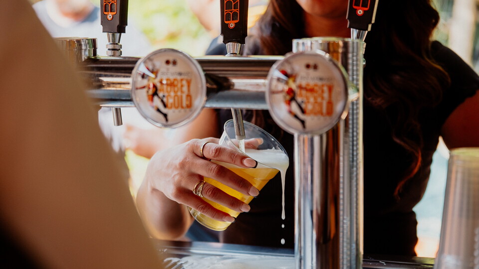 Close up of staff pouring a BrewBoard pint