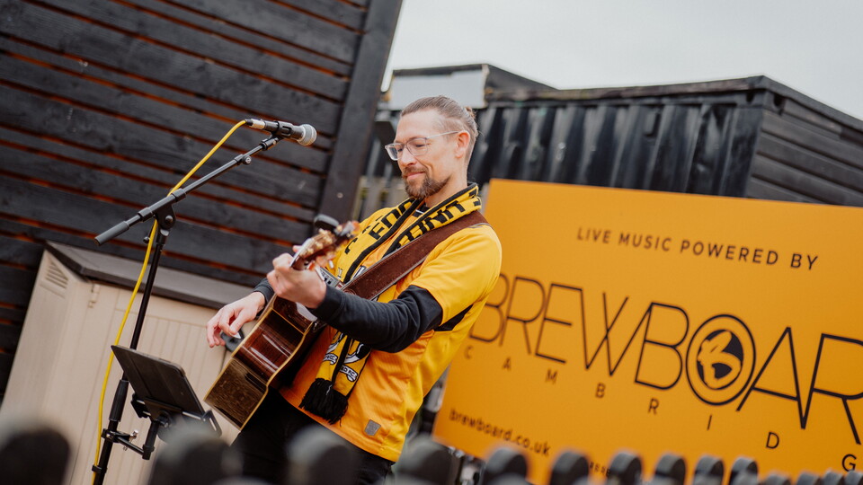 Simon Cragg performing in the Main Stand Fanzone