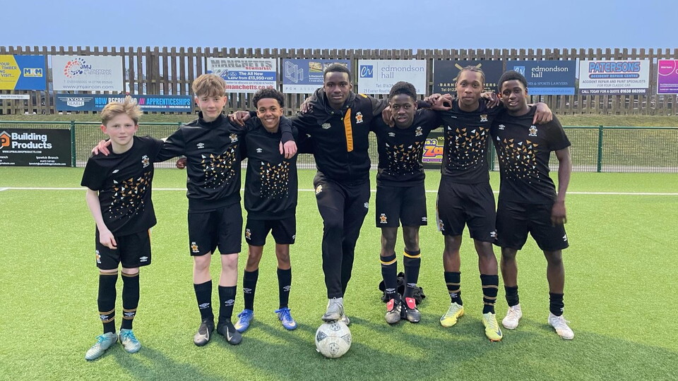 Randy Bulakio with young Academy players