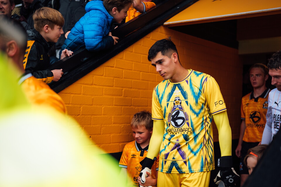 A Mascot walks out at the Cledara Abbey Stadium