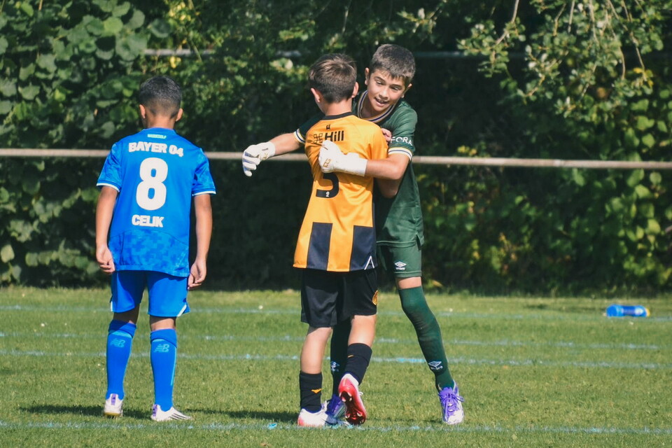 Academy players celebrate