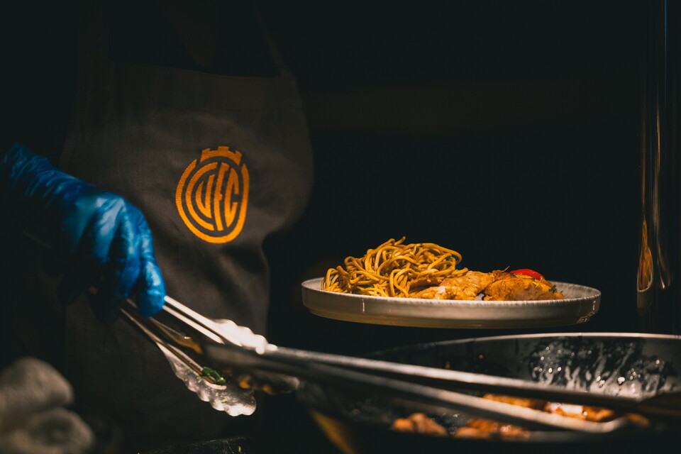 A chef cooking in Hospitality