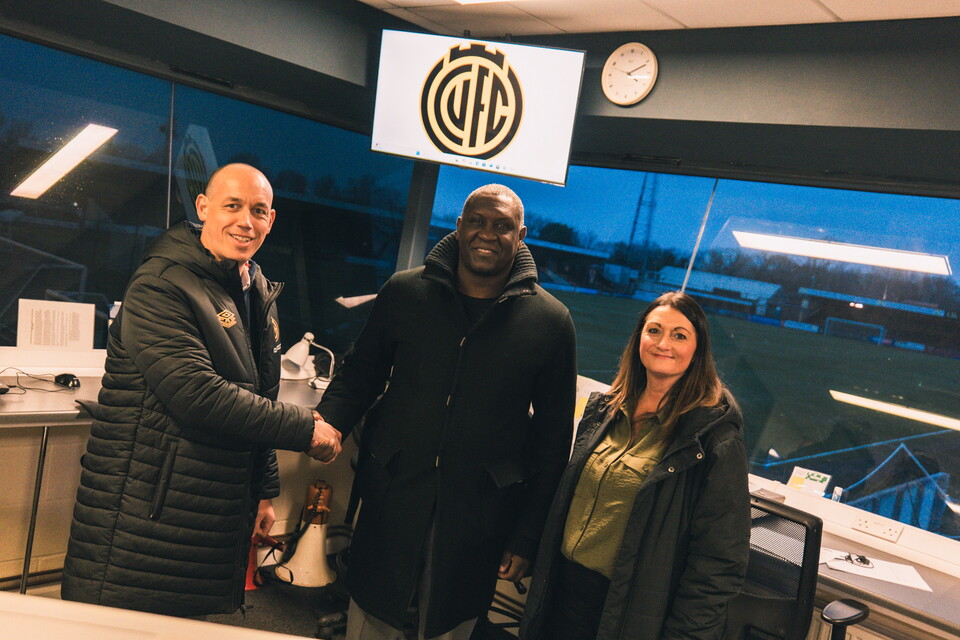 Emile Heskey with Cambridge United staff
