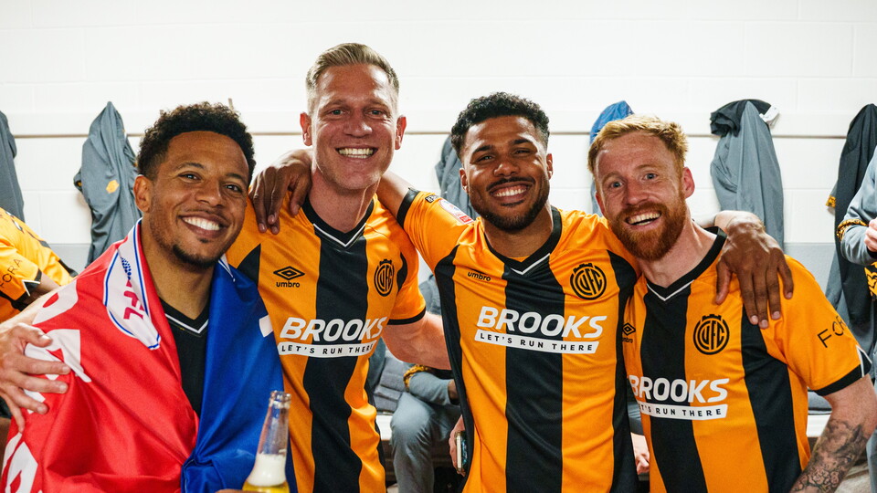 Cambridge United players celebrate promotion 
