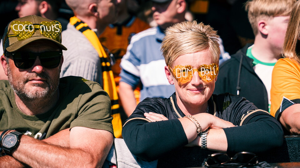 Fans wearing custom glasses