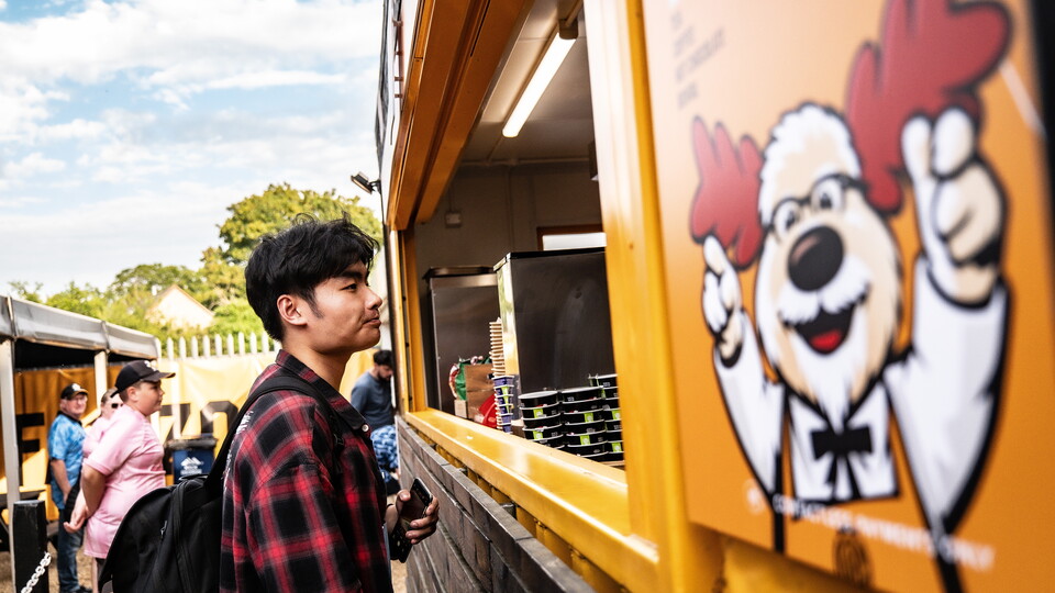 A fan buying food at the Cledara Abbey Stadium