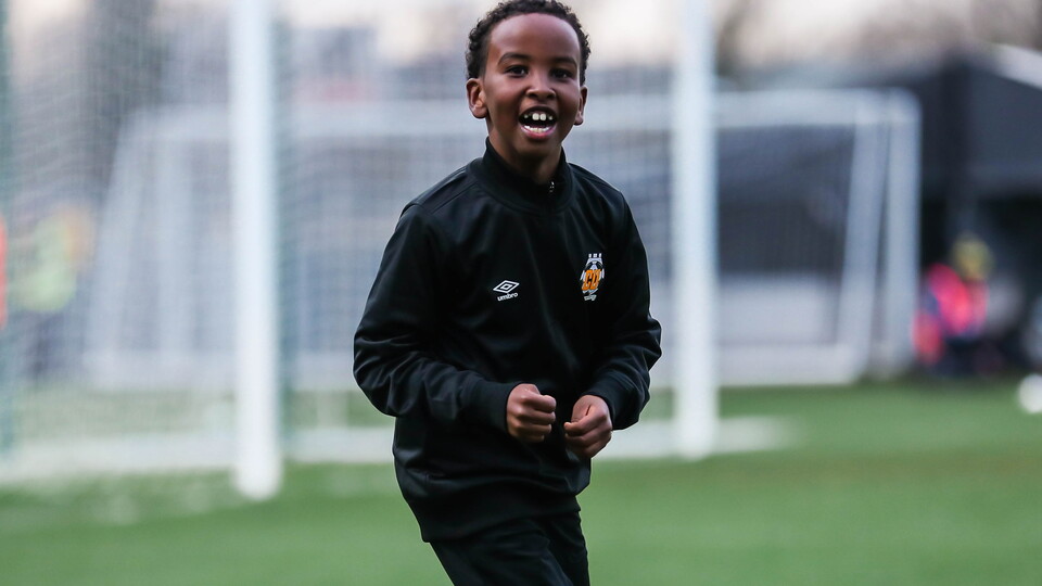 A young Academy player on the Cledara Abbey Stadium pitch