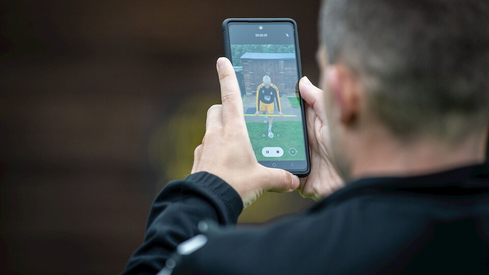 A member of staff records a player during pre-season testing