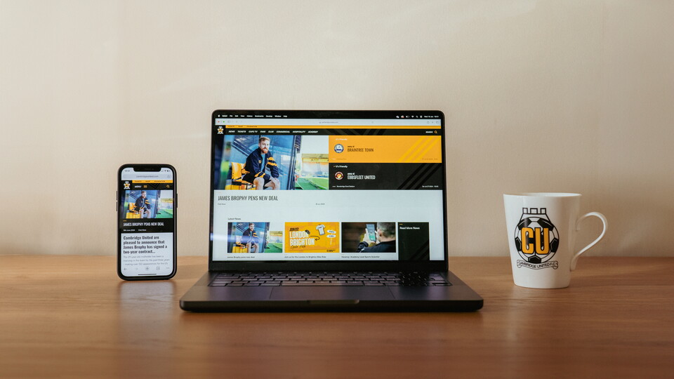 The new Cambridge United website on a laptop and phone
