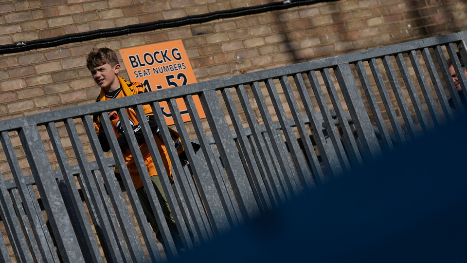 A young supporter makes his way inside the Cledara Abbey Stadium