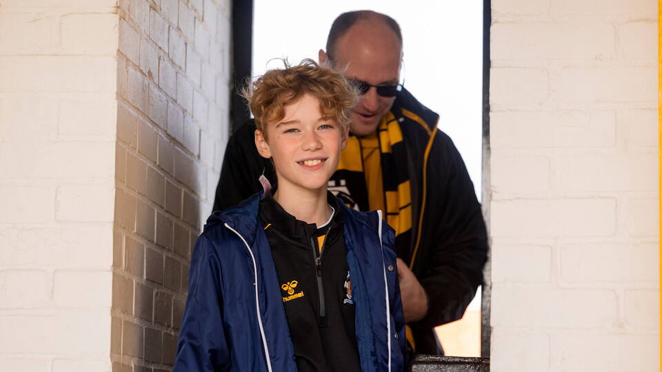 Fans enter through the turnstiles