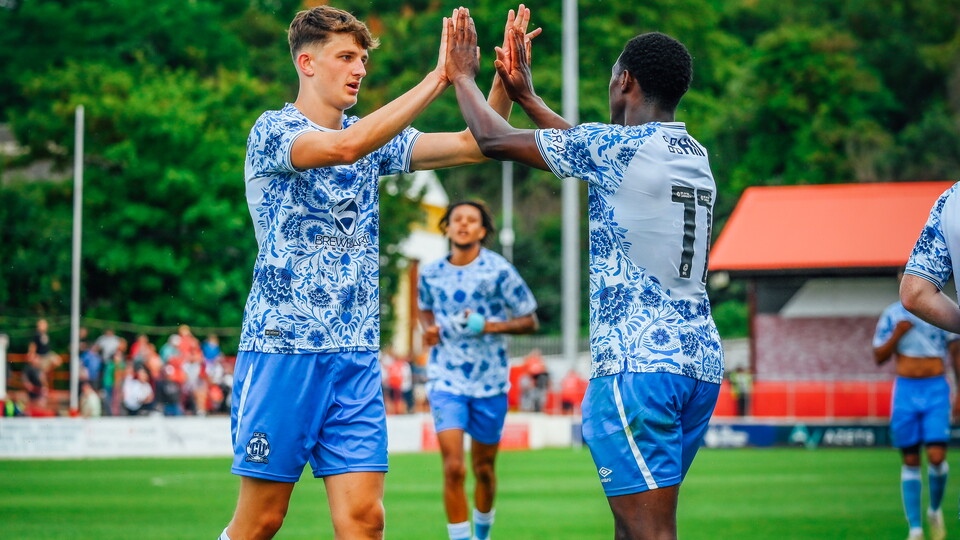 Munday and Kaikai celebrate together