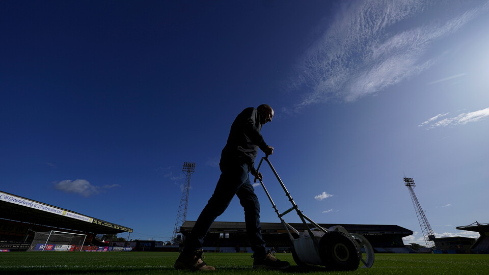 Ian Darler cuts the grass at the Cledara Abbey Stadium