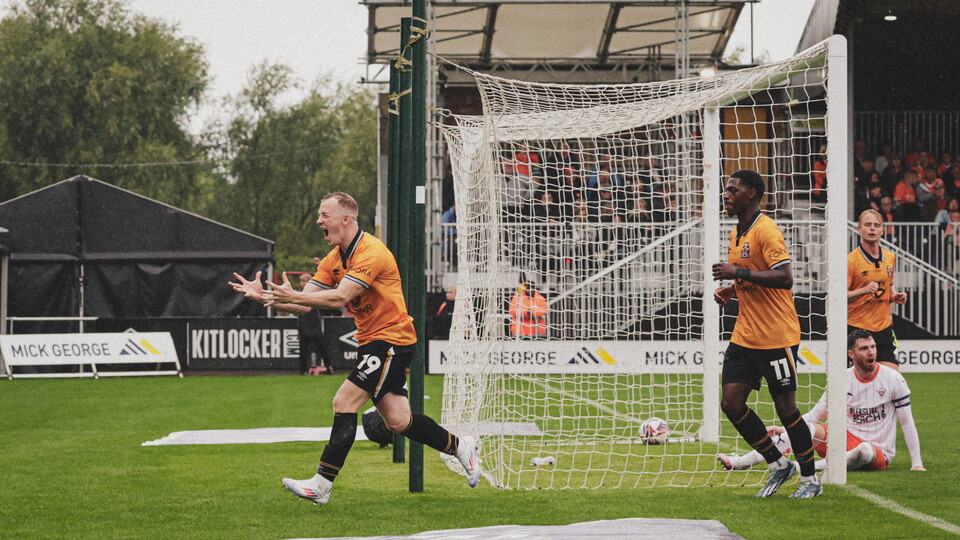Shayne Lavery celebrates in-front of the Blackpool fans