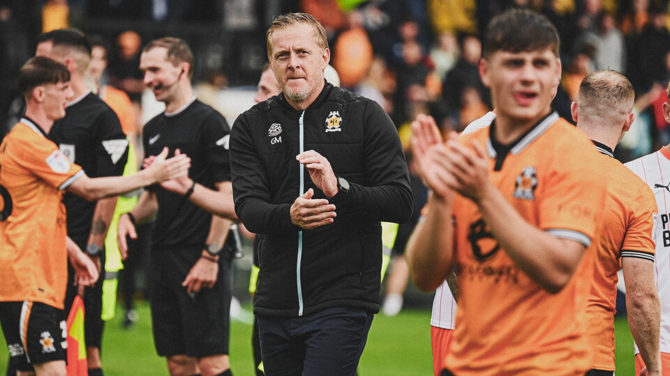 Garry Monk applauds the supporters