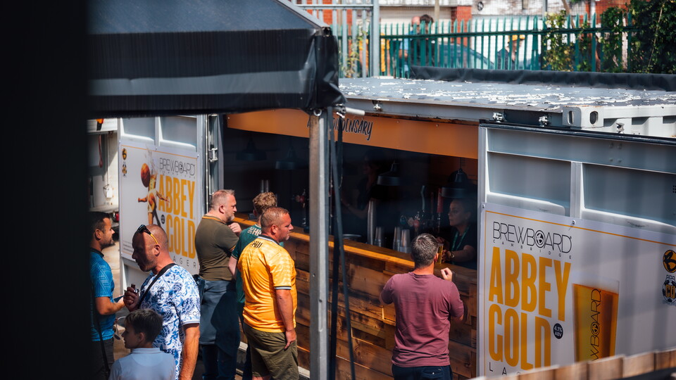 Fans buying a drink at the Cledara Abbey Stadium
