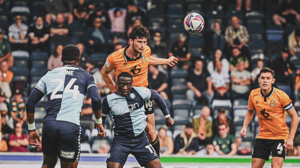 Zeno Ibsen Rossi heading the ball against Wycombe