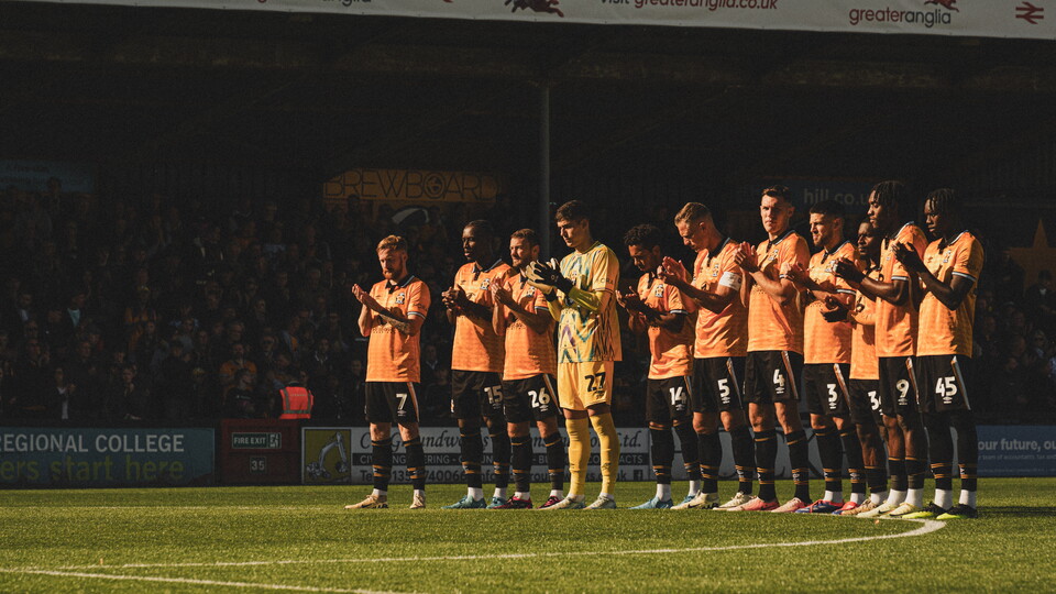 Players take part in a pre-match tribute