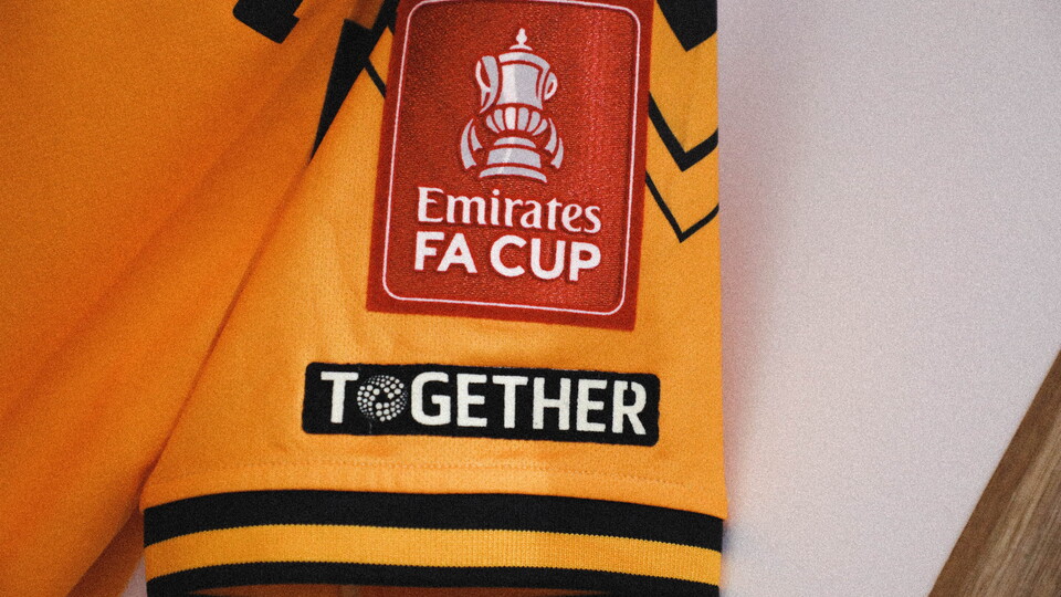 A close up of United's shirt with Emirates FA Cup branding