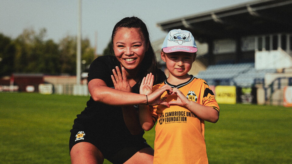 Bella Simmons with a young fan